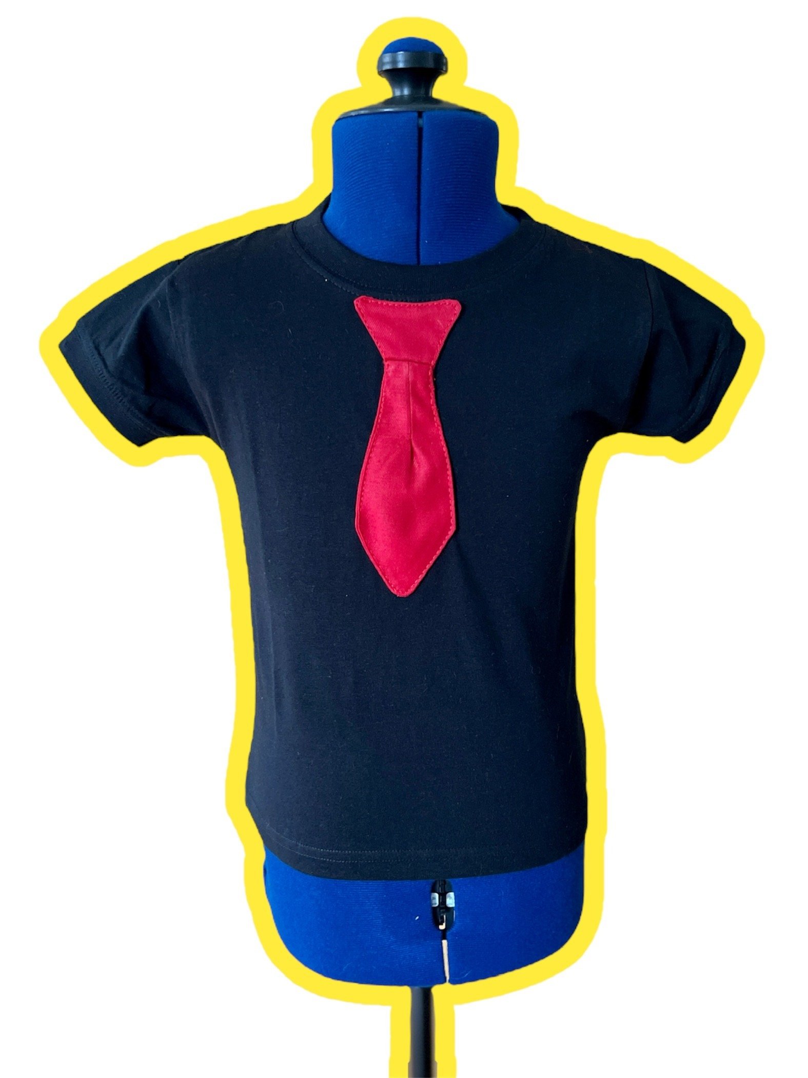 Red tie applique stitched onto a black tee